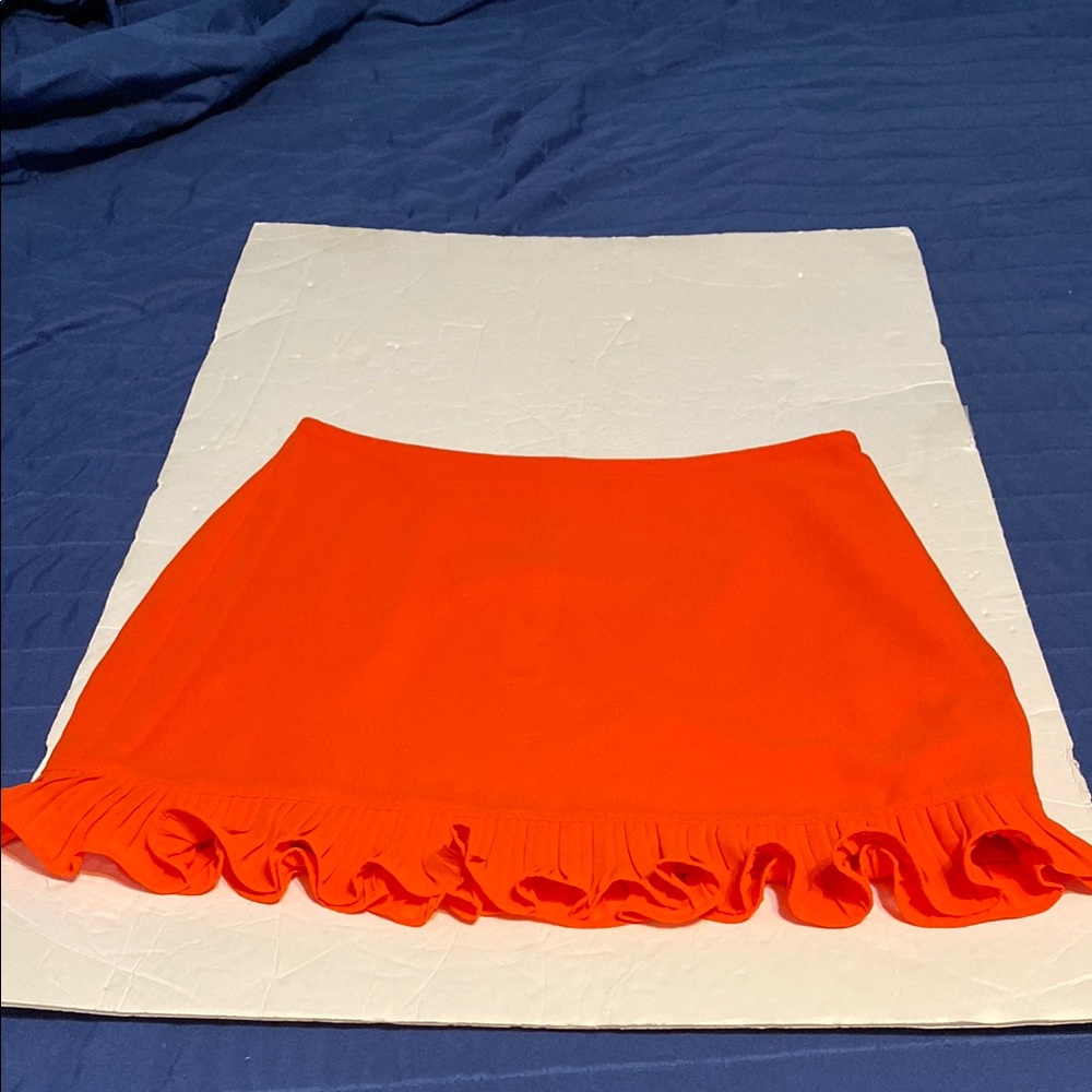 NWT Naked Zebra Bright Orange mini Skirt. Side zipper. 2 tiny dots bottom front